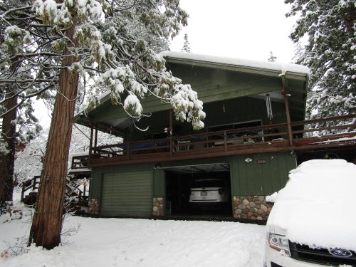 snow on cabin